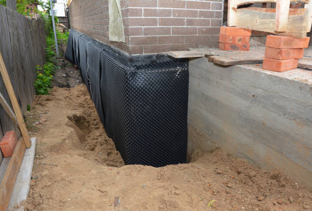 SJ Waterproofing Pros technician performing targeted Exterior Waterproofing assessment in Keasbey, NJ